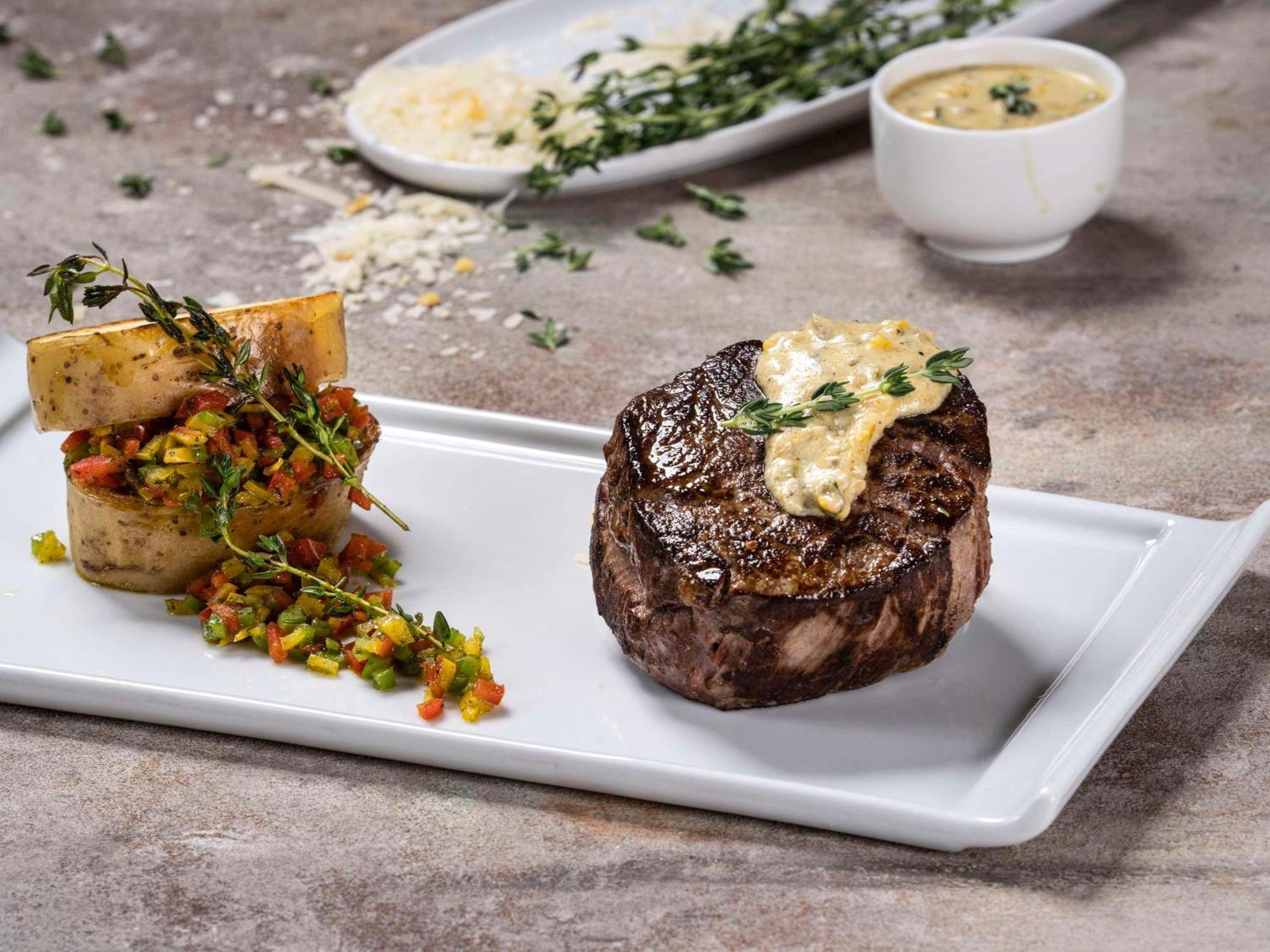 Movenpick Hotel And Residences Rijád Exteriér fotografie A steak prepared with a butter sauce